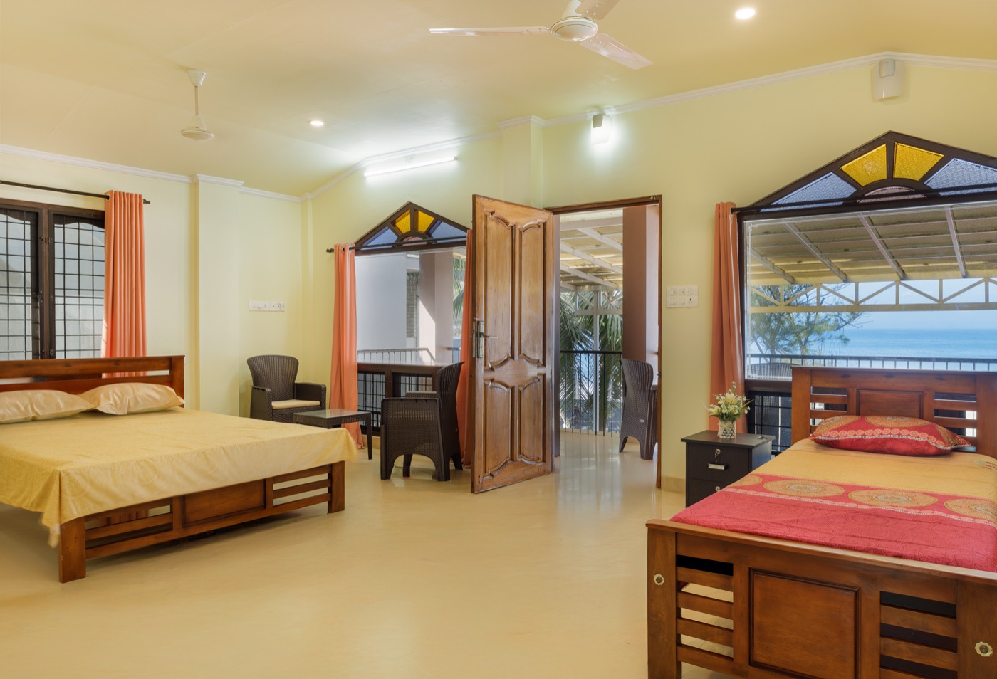 Upper-floor sea-view bedroom one with sea-facing windows