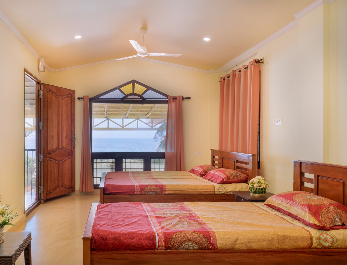 Upper-floor sea-view bedroom two with a vaulted ceiling