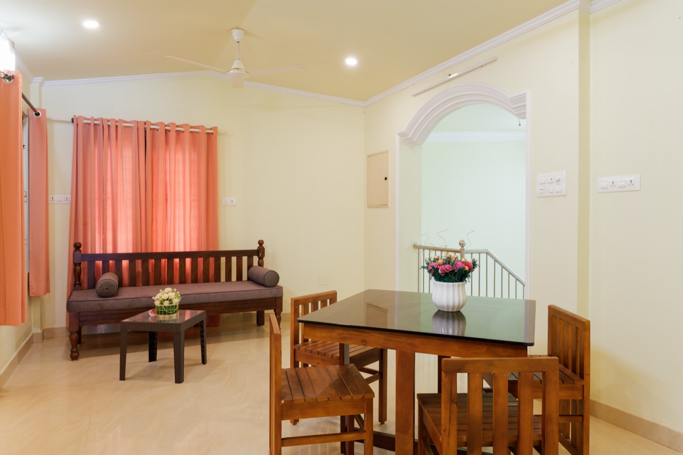 Upper-floor sitting area with sofa and dining table