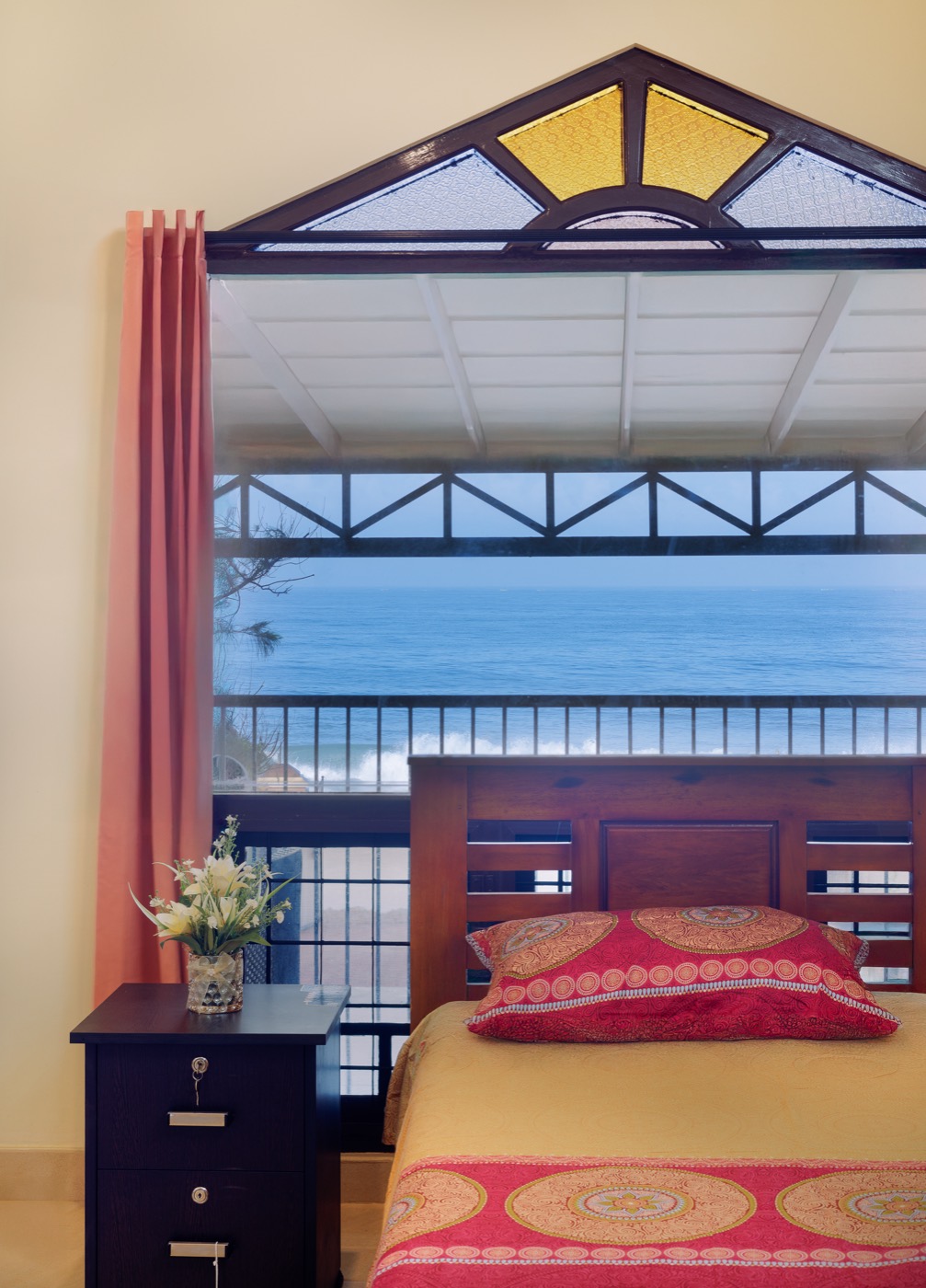 Sea view through the gabled window beside the bed
